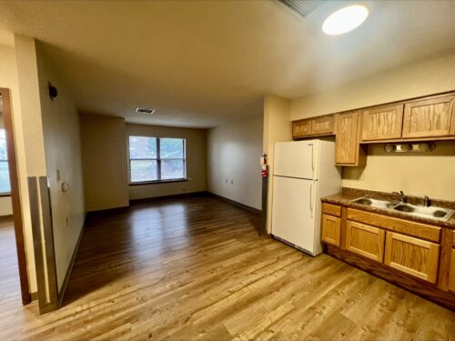 The kitchen and dining area in a living space offered through affordable housing services
