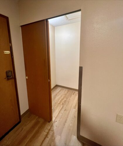 A closet in a living space offered through affordable housing services